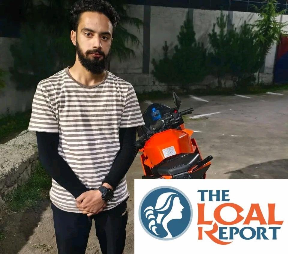 Police detains the motorcycle driver for careless driving in the Lal Bazaar of Srinagar.