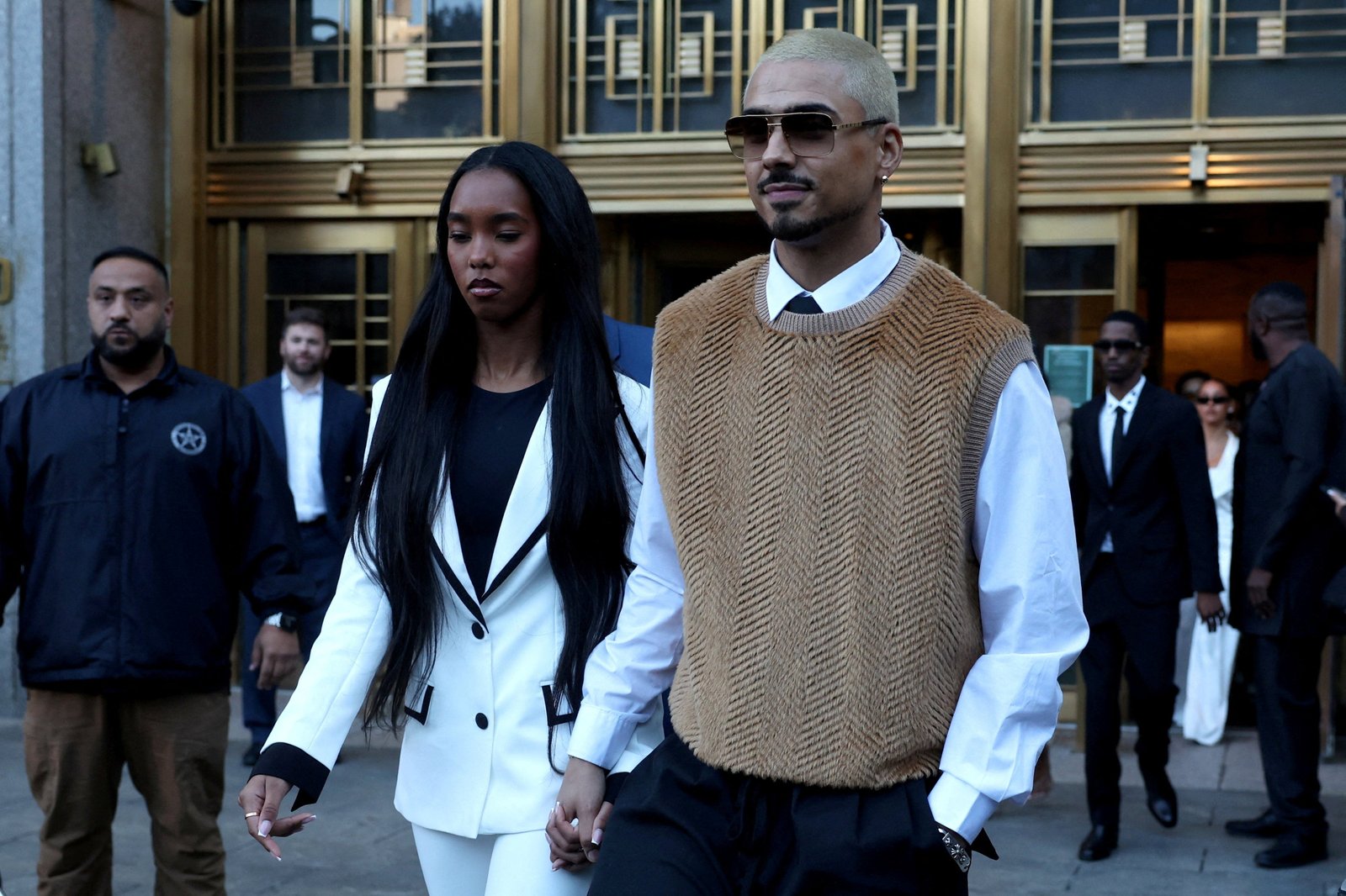 Quincy Combes and D 'Lila Combes leave the court after giving emotional arguments before being sentenced to their father.