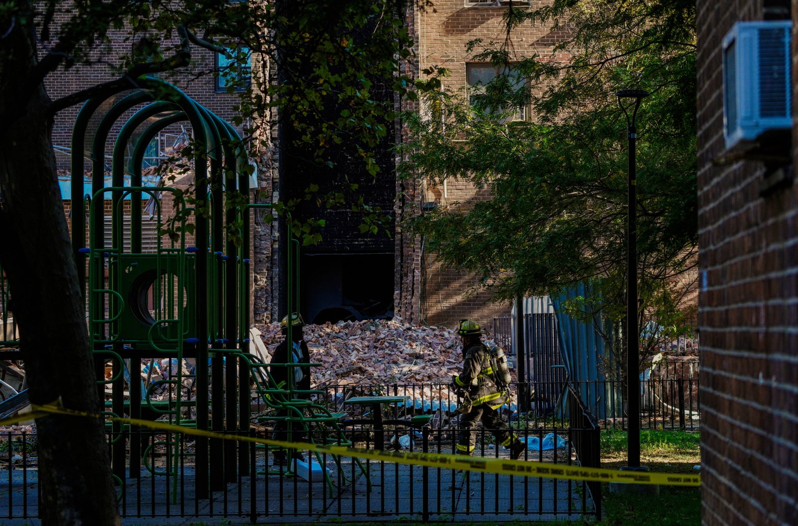 Firefighting Boro, New York, works near a building collapse on Wednesday, October 1, 2025. (AP Photo/Eduardo Munose Alverez)