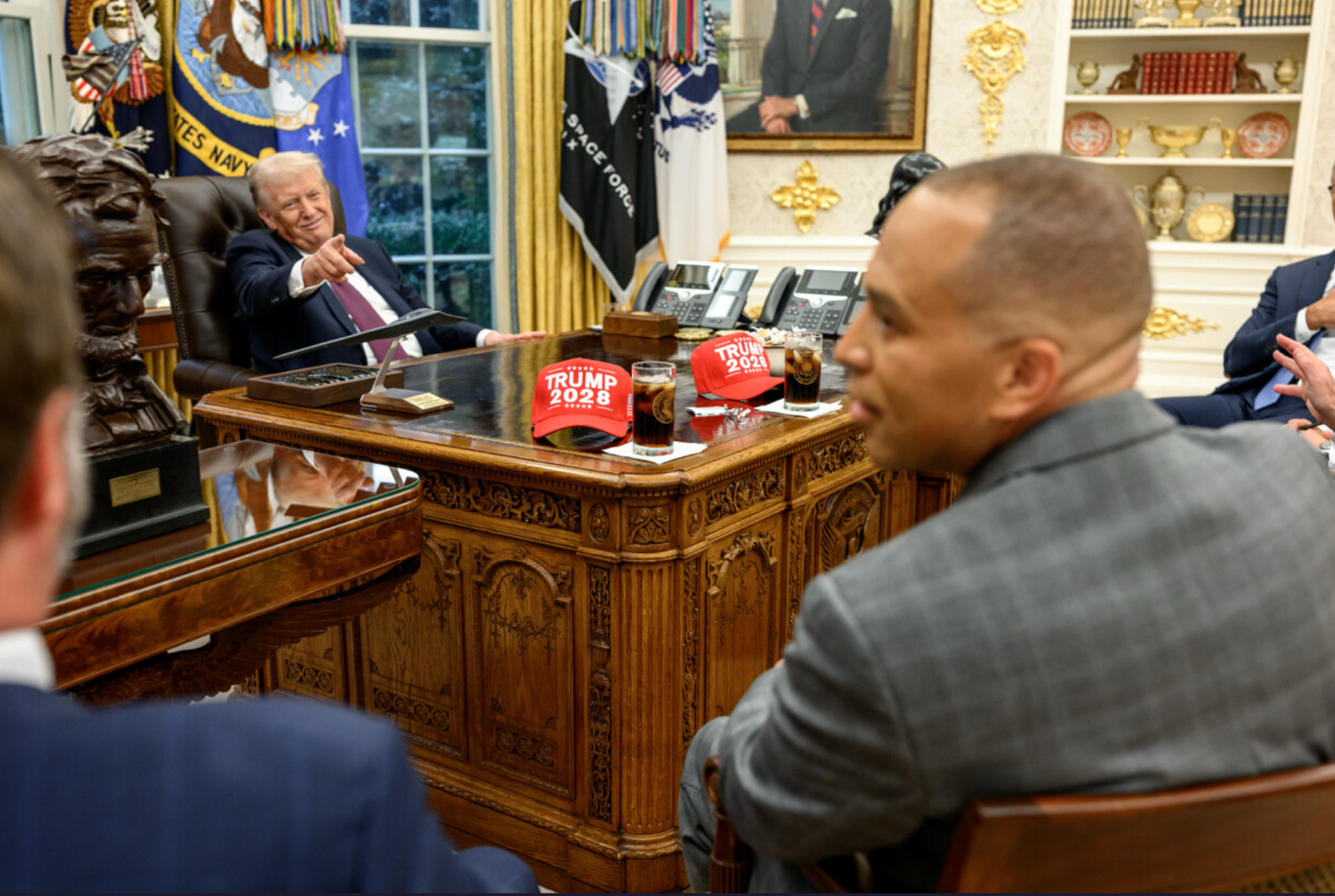 During a conversation at Donald Trump Oval Office, Hakim points to Jeffreies, aimed at escaping two 'Trump 2028' hats with the objective of avoiding the government shutdown.
