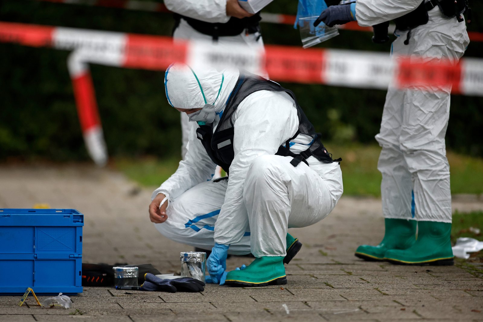 Officials examined a car fire scene in Munich, Germany on Wednesday