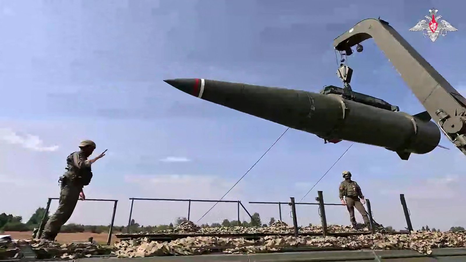 Russian soldiers load an Iskander missile on a mobile launcher during military exercise at an unknown place in Kaliningrad area of ​​Russia.