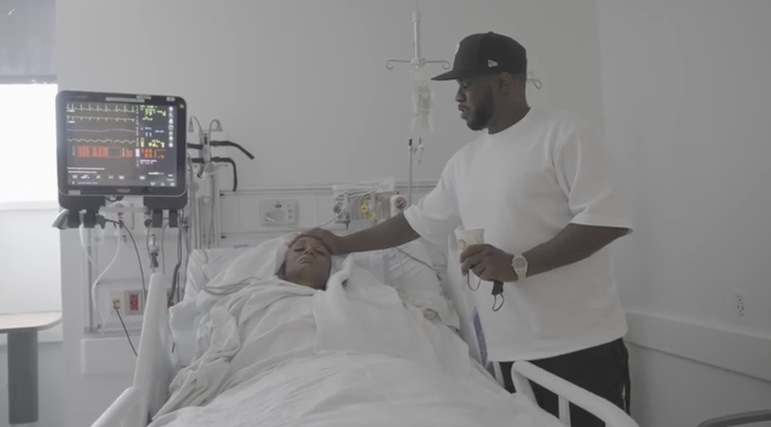In a clip, Combs is seen taking care of his late partner Kim Porter in the hospital before his death in 2018.