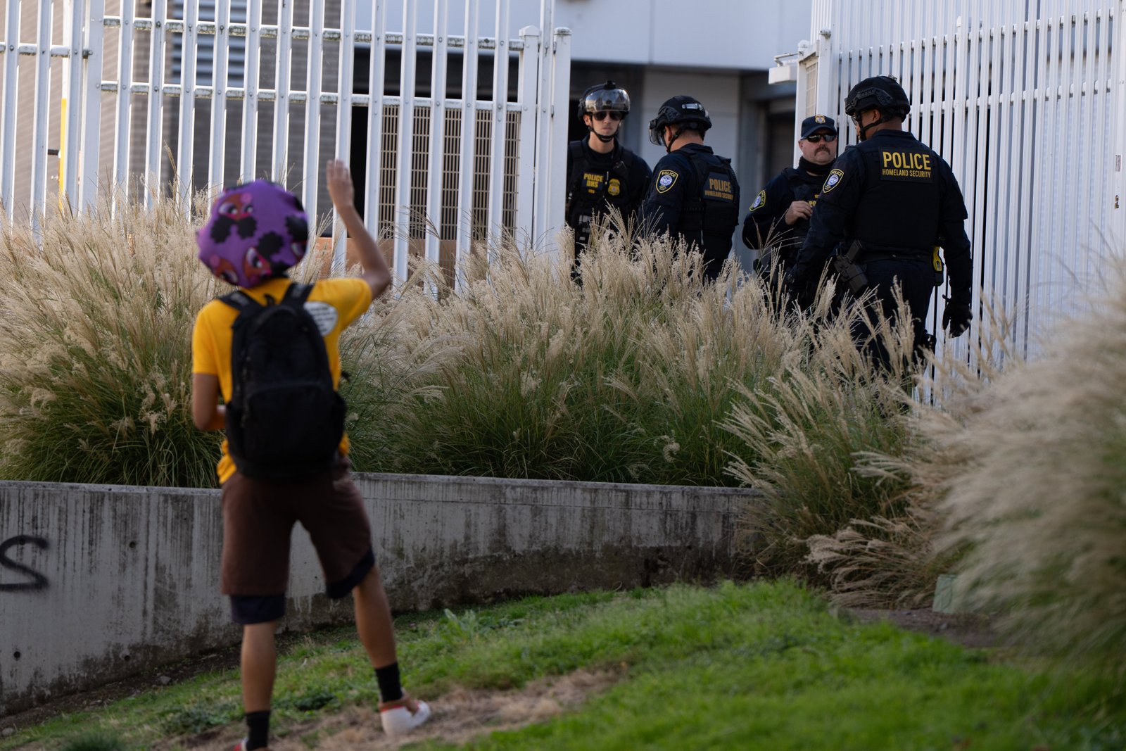 A protesting waves in federal agents outside an ice facility in Portland, Oregon.