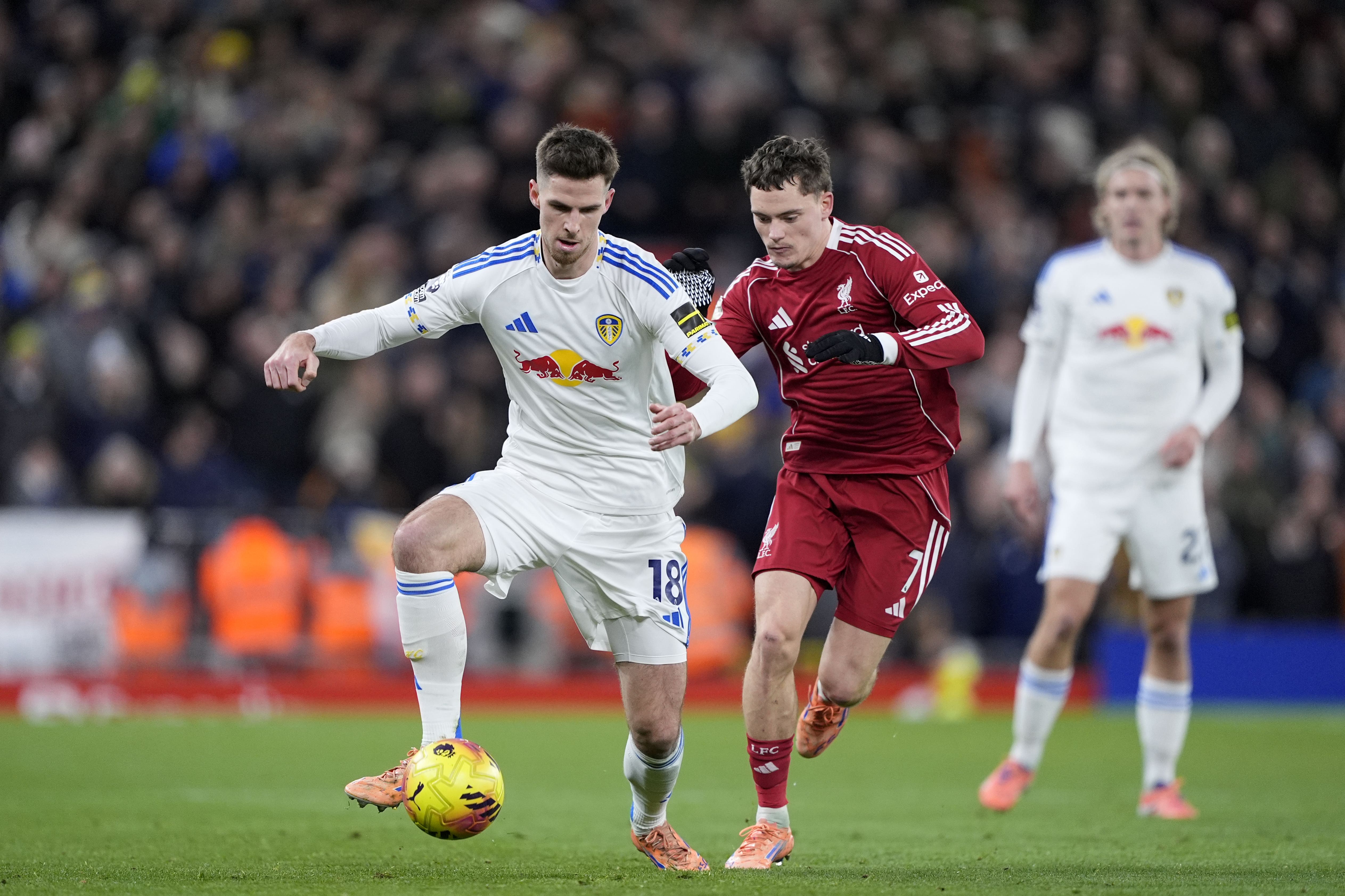 Leeds United's Anton Stach (left) and Liverpool's Florian Wirtz (right) fight for the ball (Peter Byrne/PA)