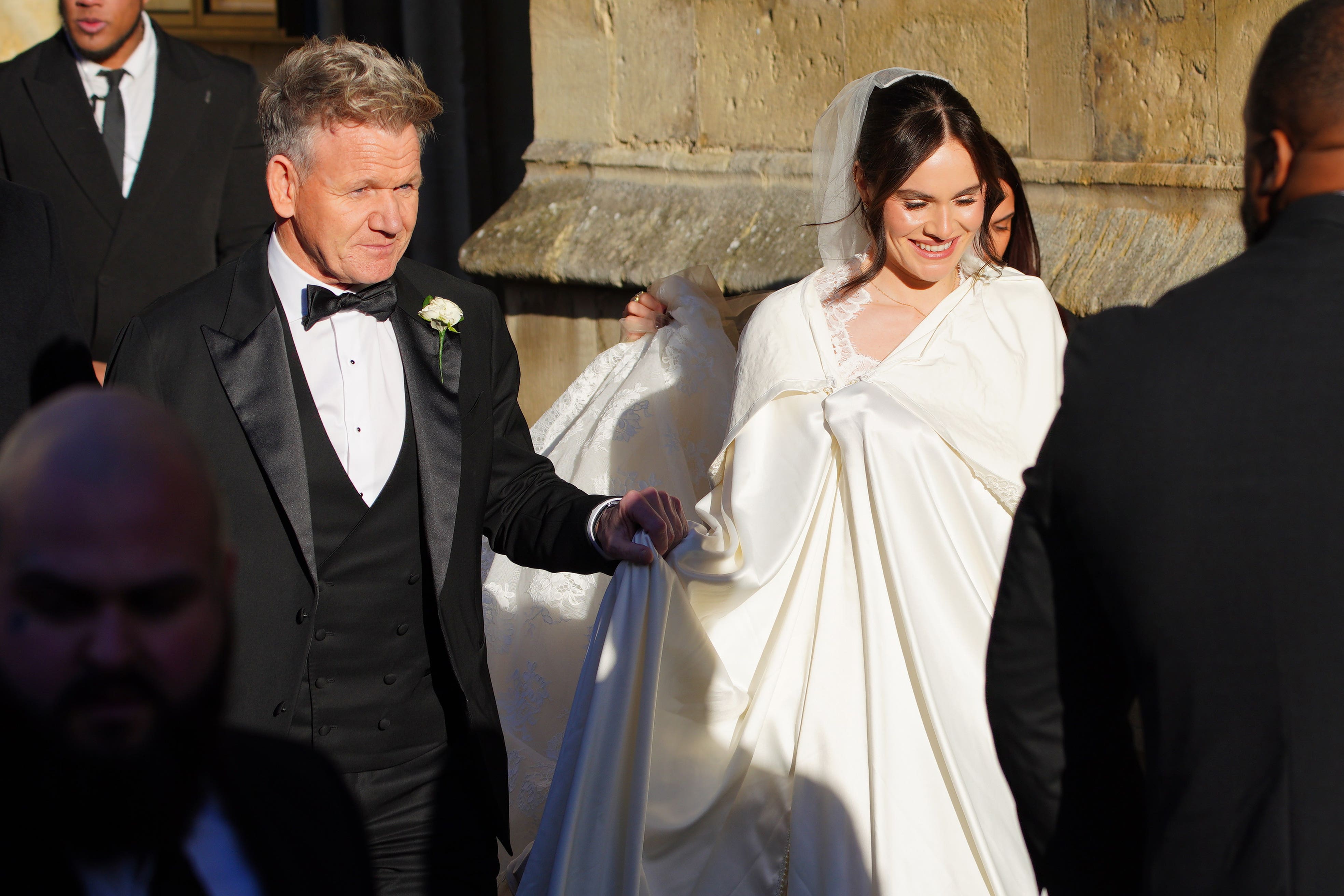 Celebrity chef Gordon Ramsay walked hand in hand with his 25-year-old daughter into Bath Abbey for the ceremony