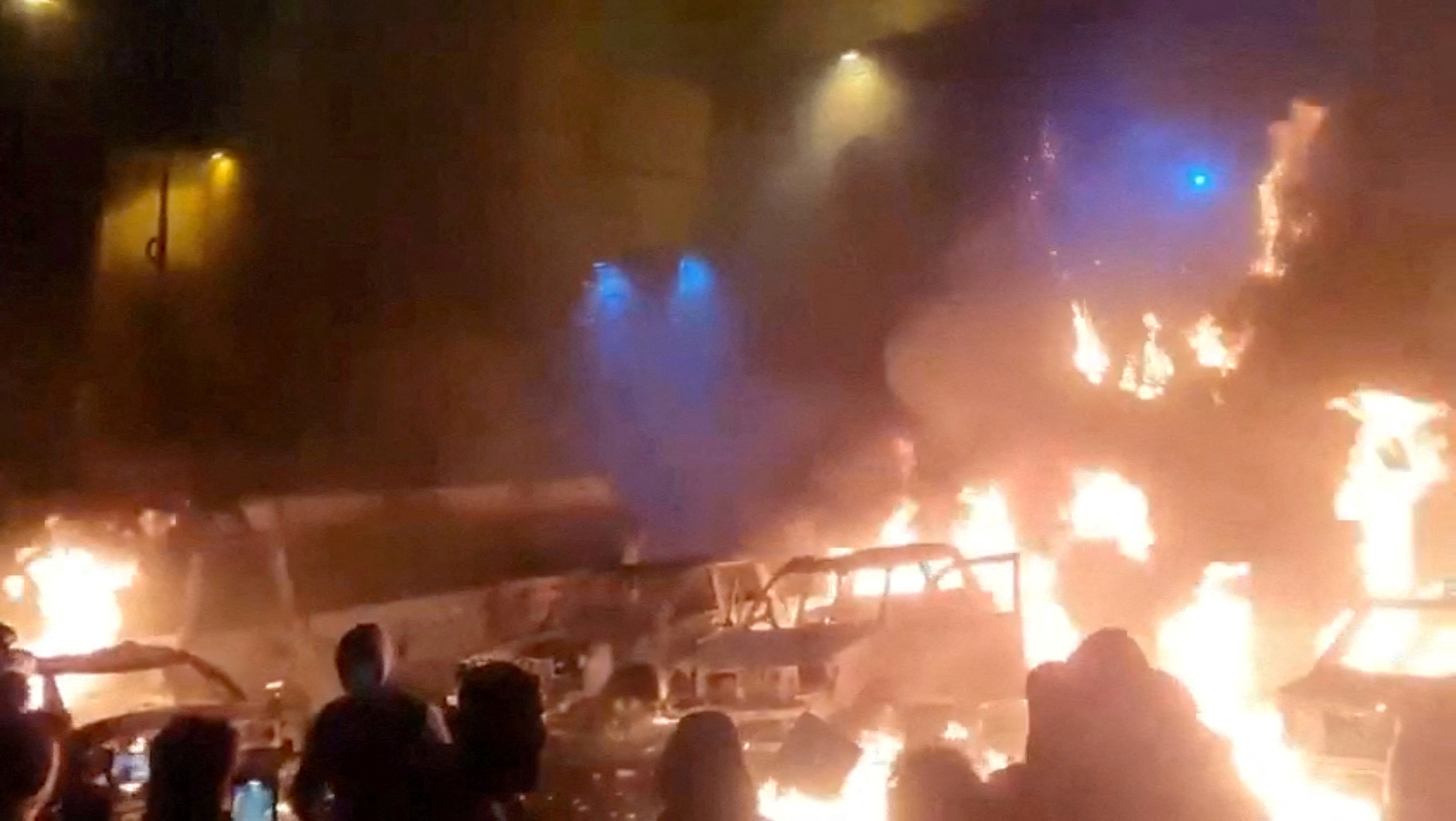 FILE PHOTO: Protesters gather and vehicles are set on fire during evolving anti-government unrest in Tehran, Iran, in this screenshot from a social media video posted on January 9, 2026