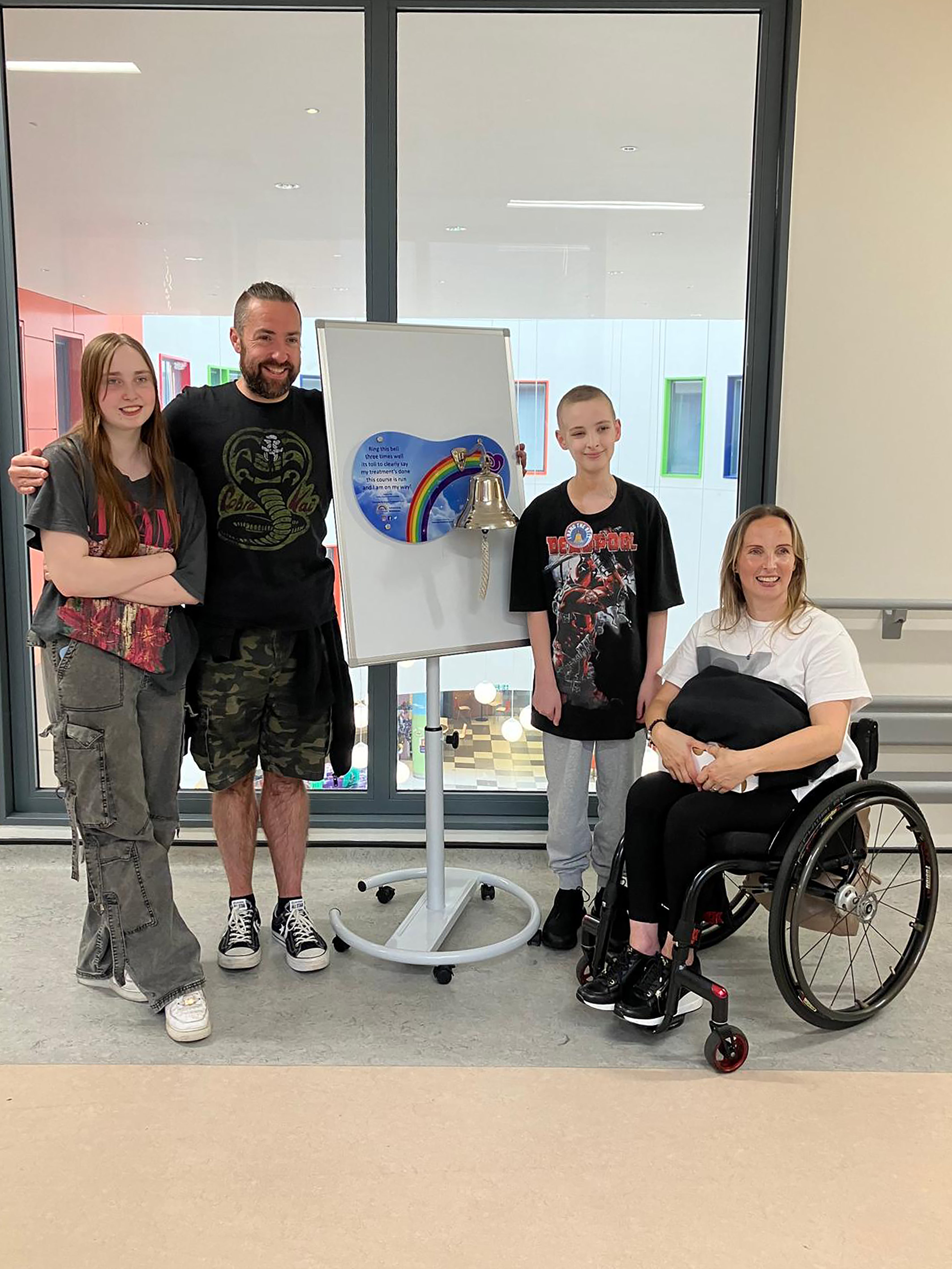Stephanie Muirhead (right) with husband Derek and daughter Alyssa plays her son Andrew, who sounds the cancer alarm at the end of treatment