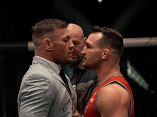 Conor McGregor (left) faces off against Michael Chandler on the set of 