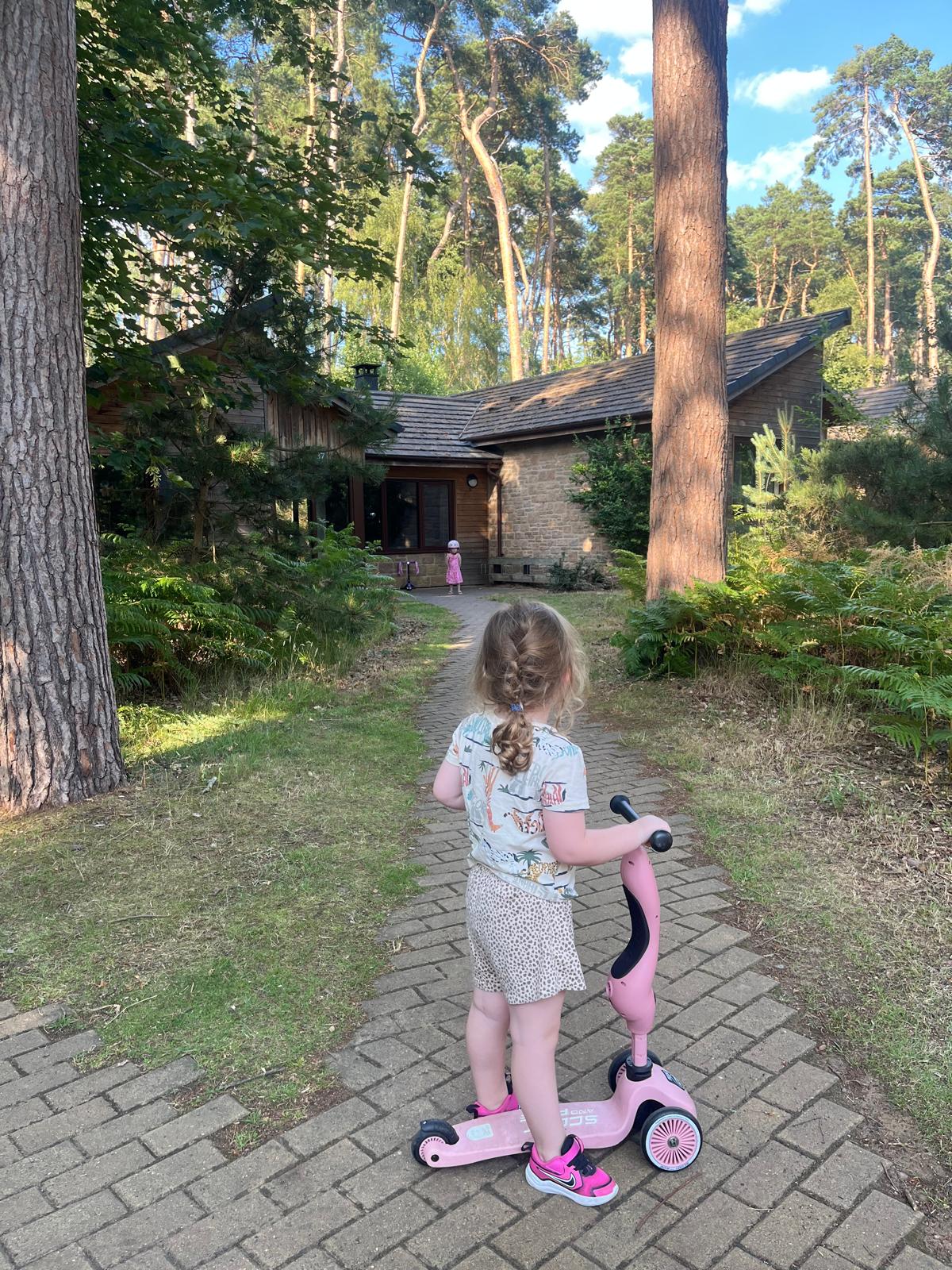 Enjoying some time on scooters outside the three-bed Forest Lodge