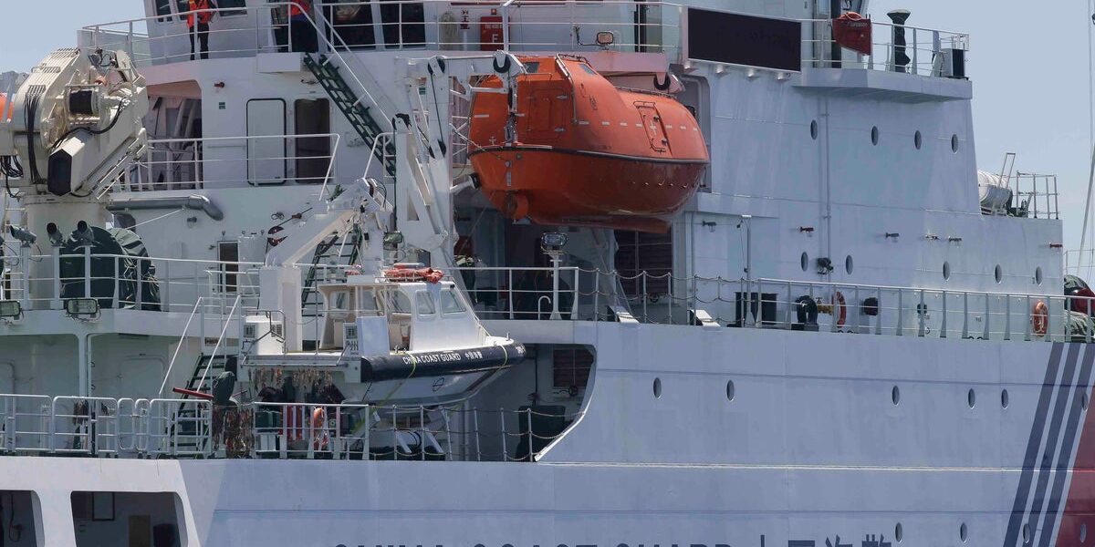 China Coast Guard says ship capsized near disputed shoal, 8 missing, 13 rescued