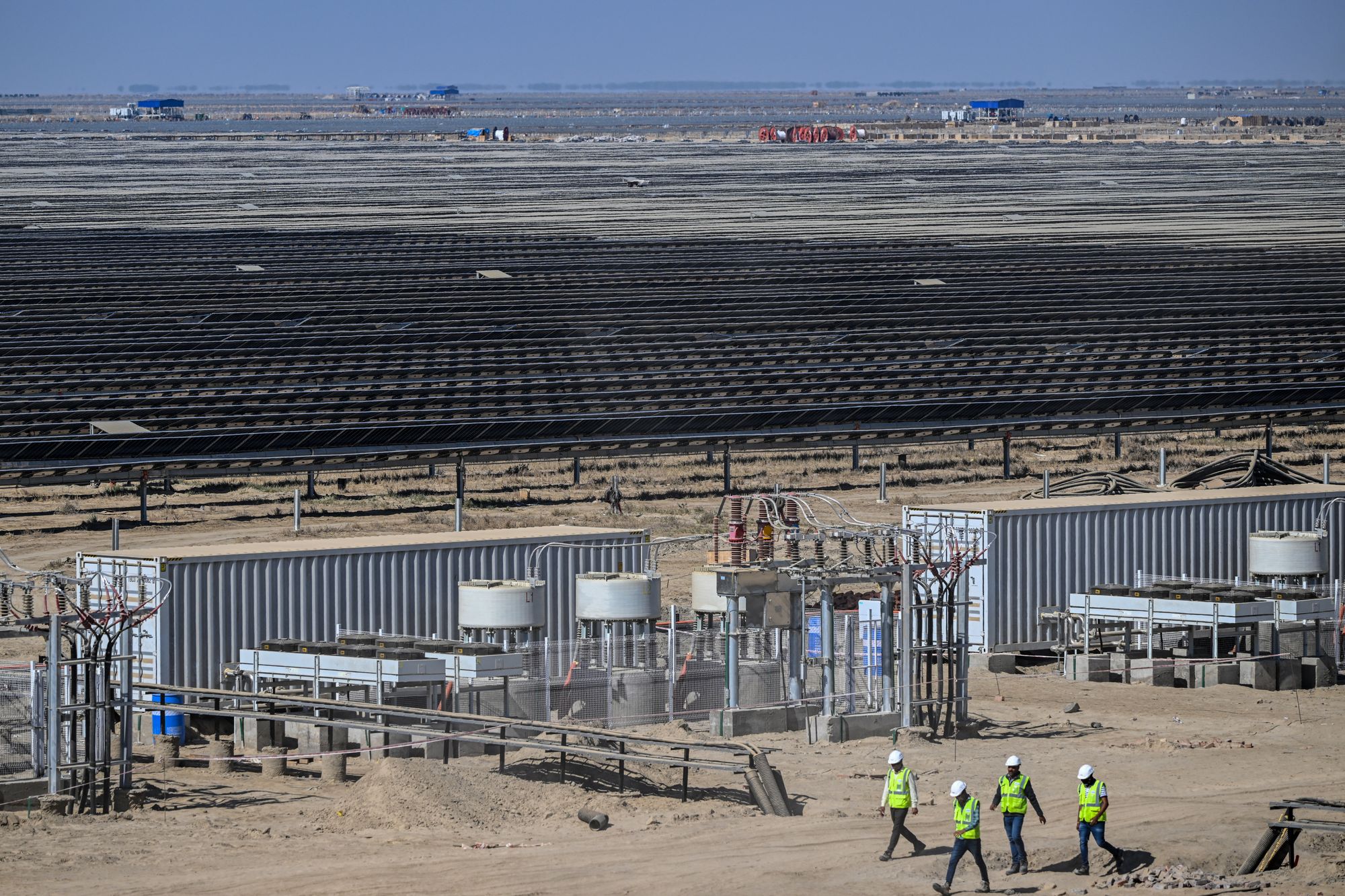 Employees at Adani Group’s Kafda Renewable Energy Park
