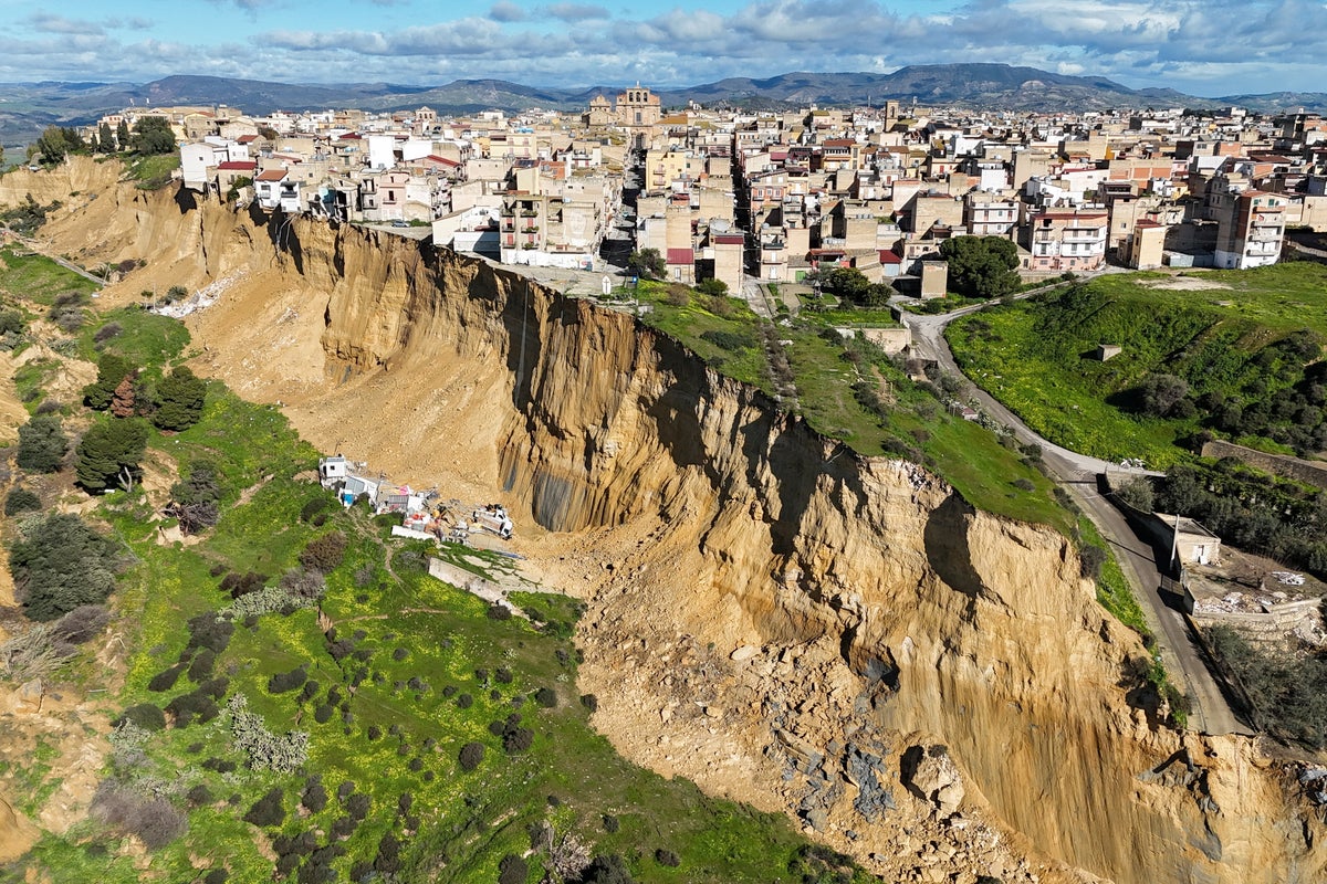 House hangs on edge of cliff after huge landslide