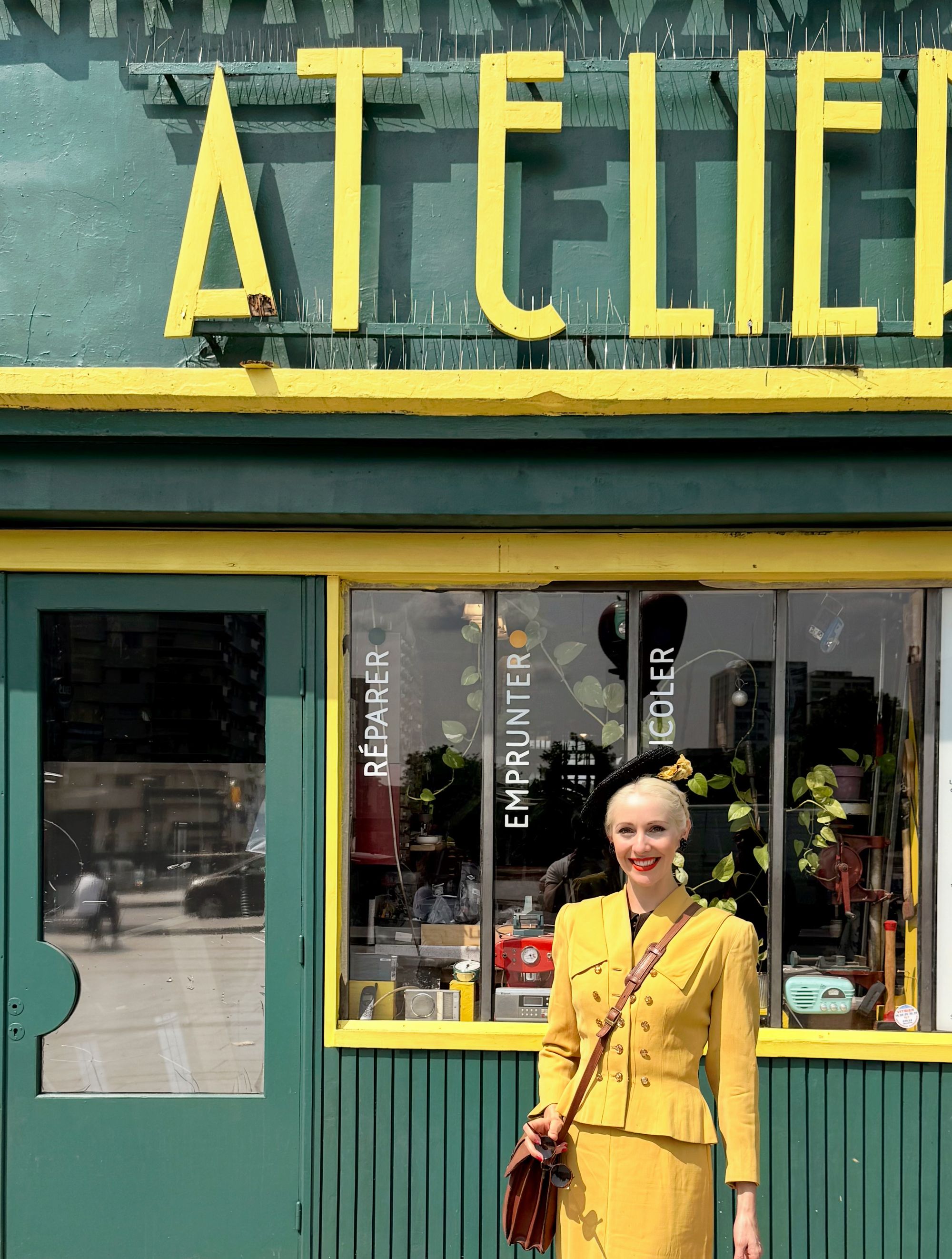 Tour guide and jazz singer Ehran leads the group on a tour of the Saint-Ouen flea market