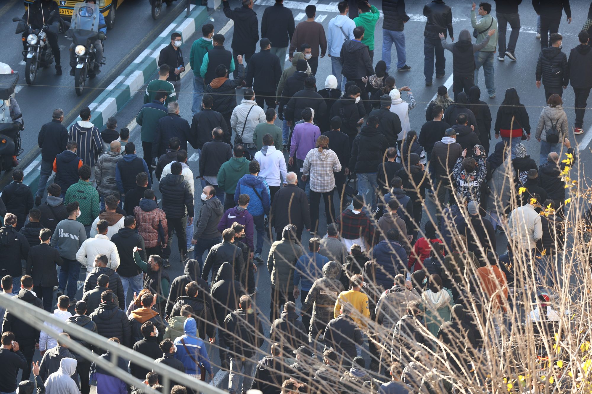 Protesters march in central Tehran