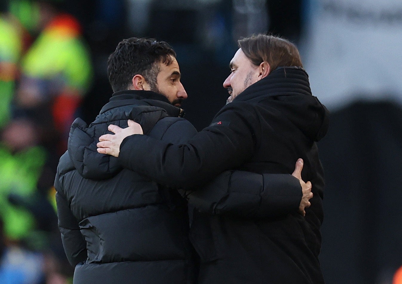 Manchester United manager Ruben Amorim talks to Leeds United manager Daniel Farke after the game