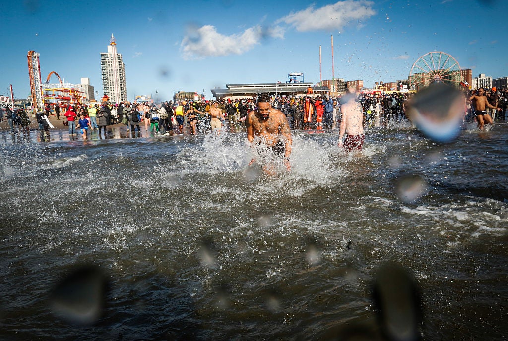 Polar Plunge on January 1, 2026 in Coney Island, New York. Experts suggest diving into financial education this year to improve your finances