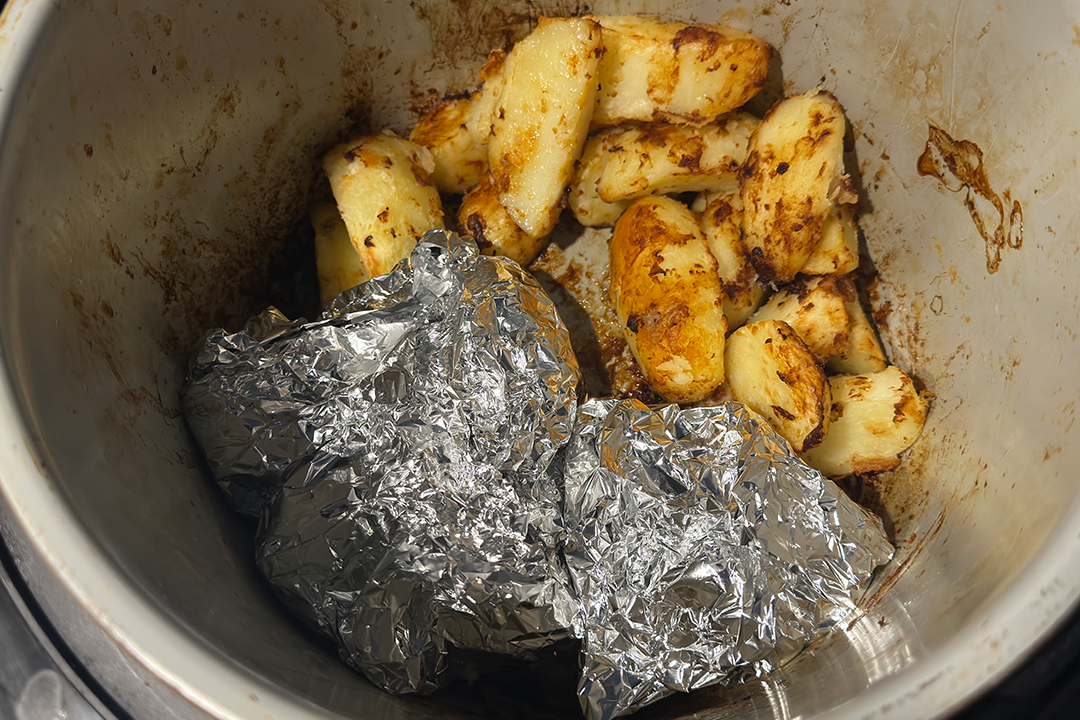 You can wrap the carrots in foil and add them when the potatoes are cooked