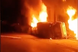 Protests in Iran turn violent as eyewitness video shows vehicles being set on fire