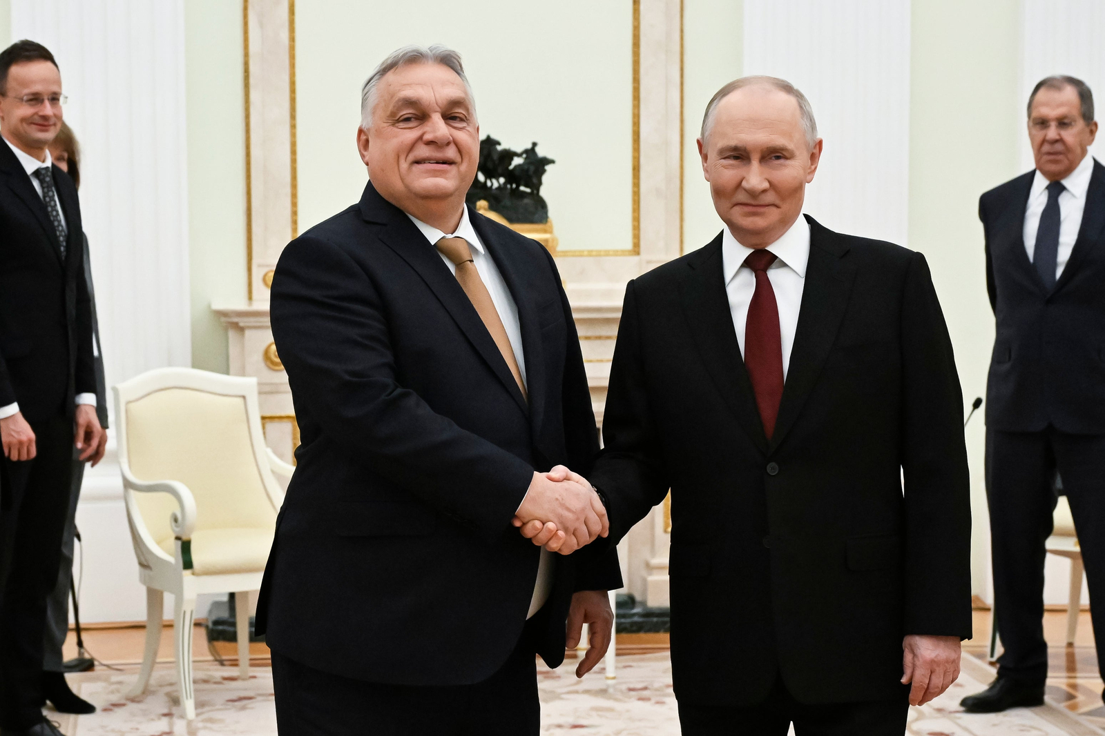 Russian President Vladimir Putin (right) and Hungarian Prime Minister Viktor Orban shake hands during a meeting in the Kremlin in November 2025.