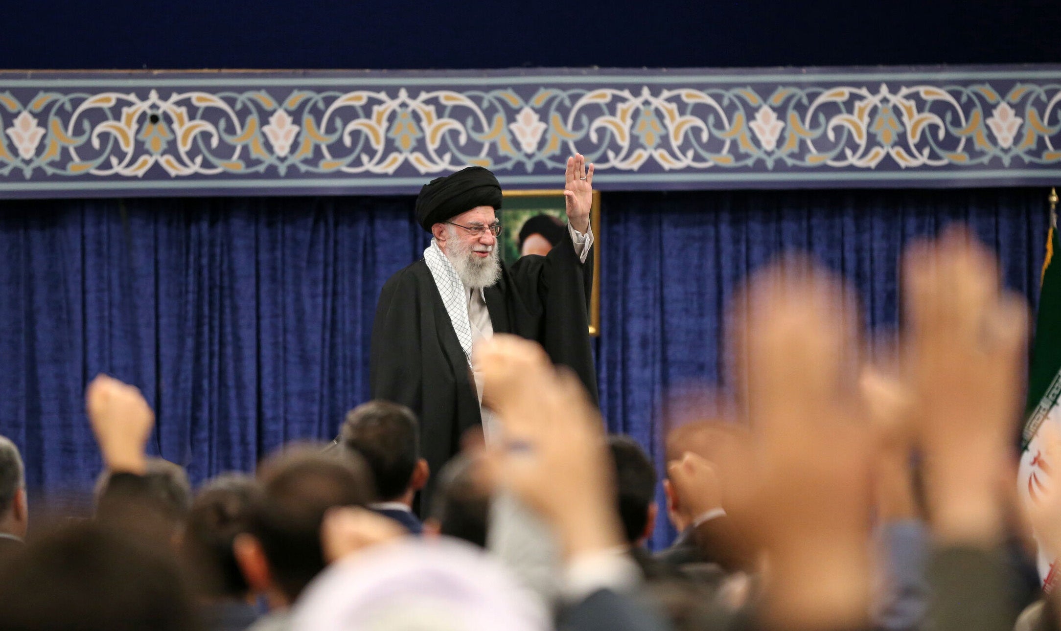Supreme Leader Ayatollah Ali Khamenei greets the crowd during a ceremony in Tehran, Iran, in October 2024
