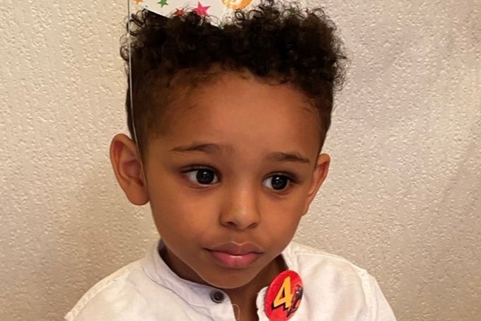 The car struck 5-year-old Fareed Amir, the driver's own 12-year-old son, and then hit five other parked cars