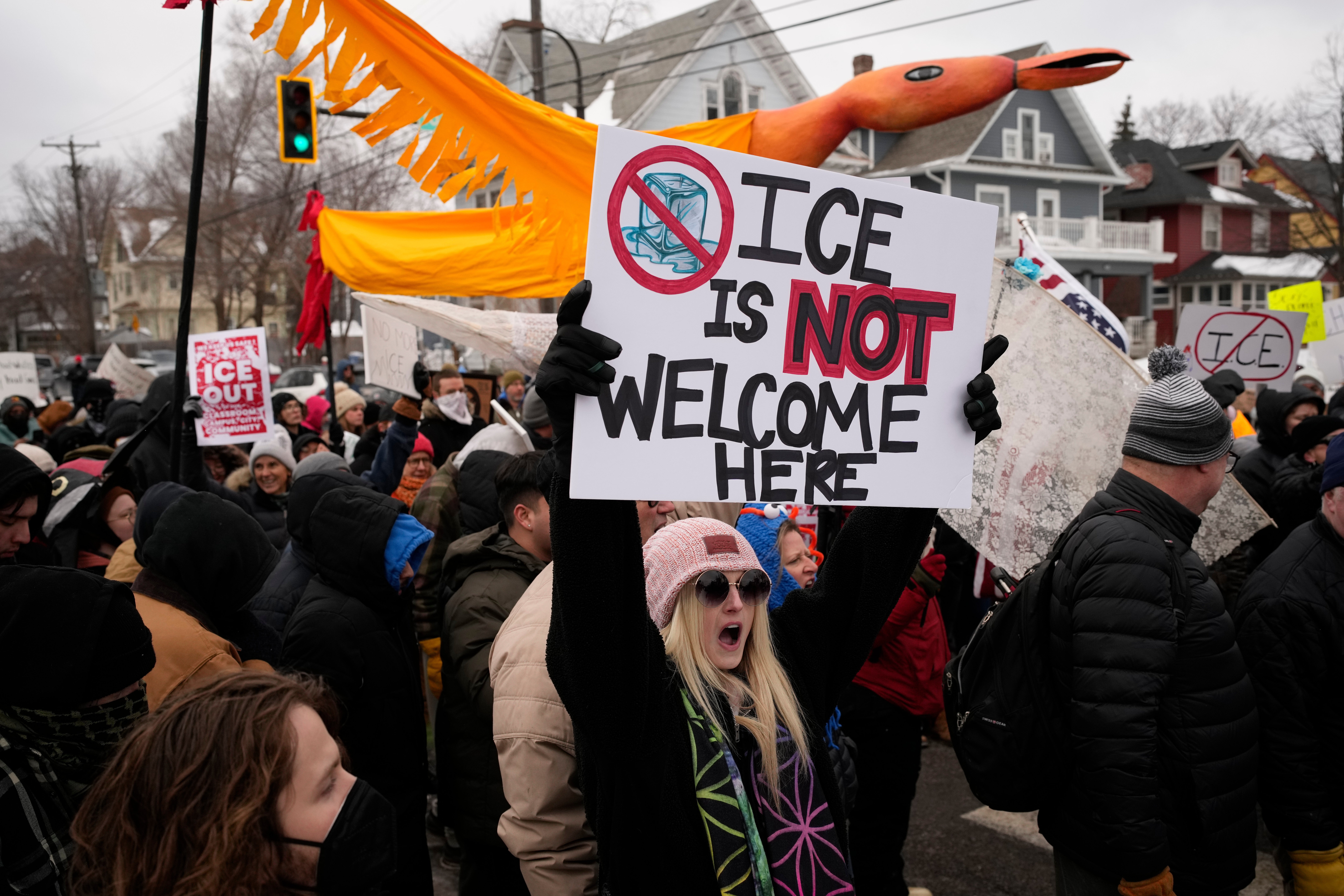 A protester in Minneapolis on Saturday held a sign stating, 