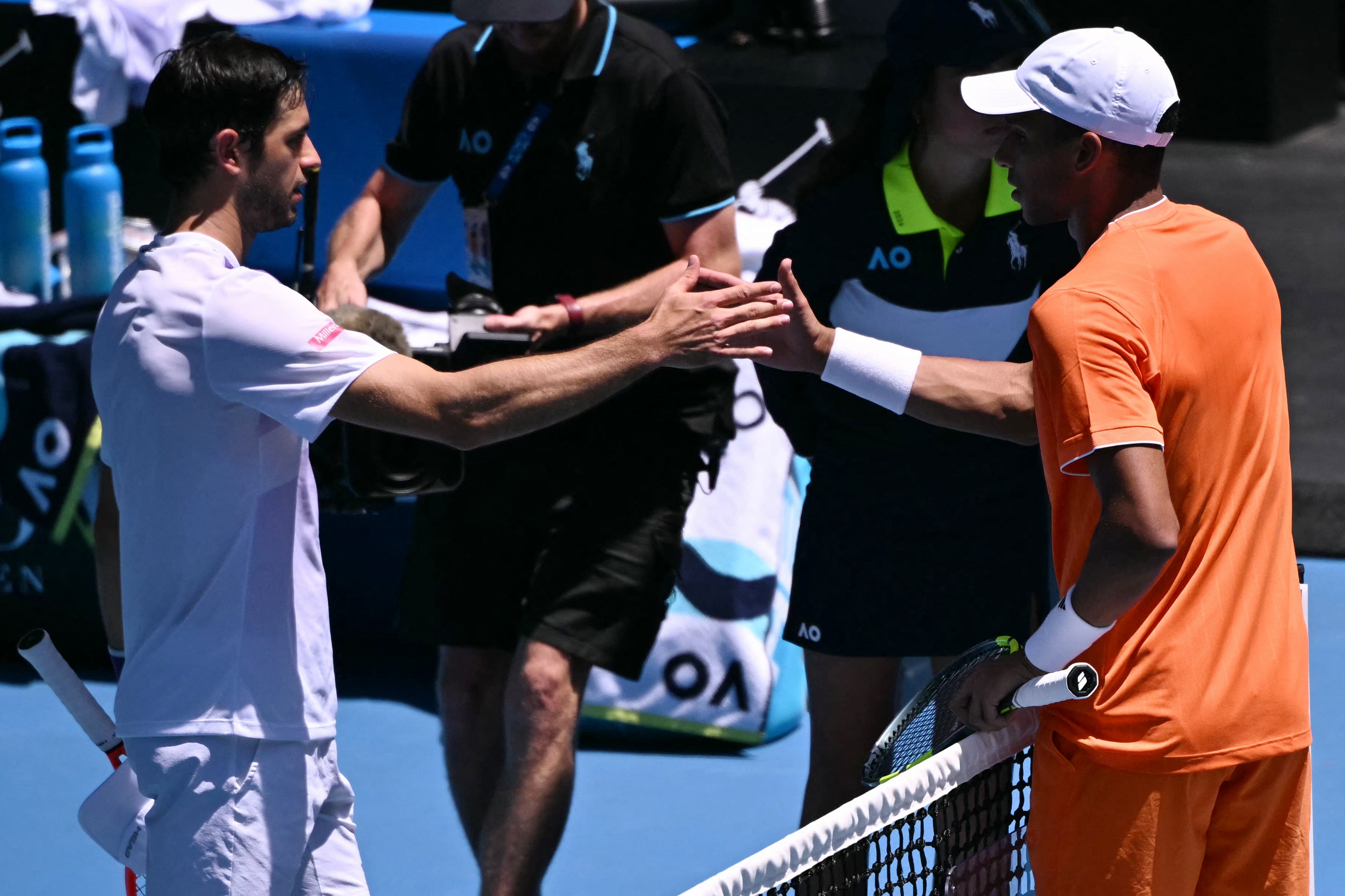 Portugal's Nuno Borges (left) is congratulated by Canada's Felix Auger-Aliassime, who retired due to injury