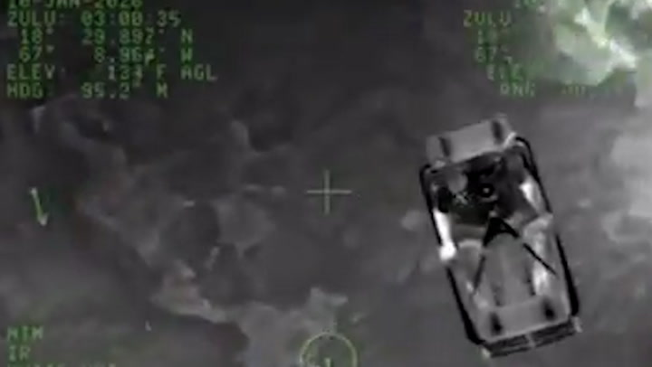 The moment a trapped surfer is rescued after drifting at sea for 30 hours