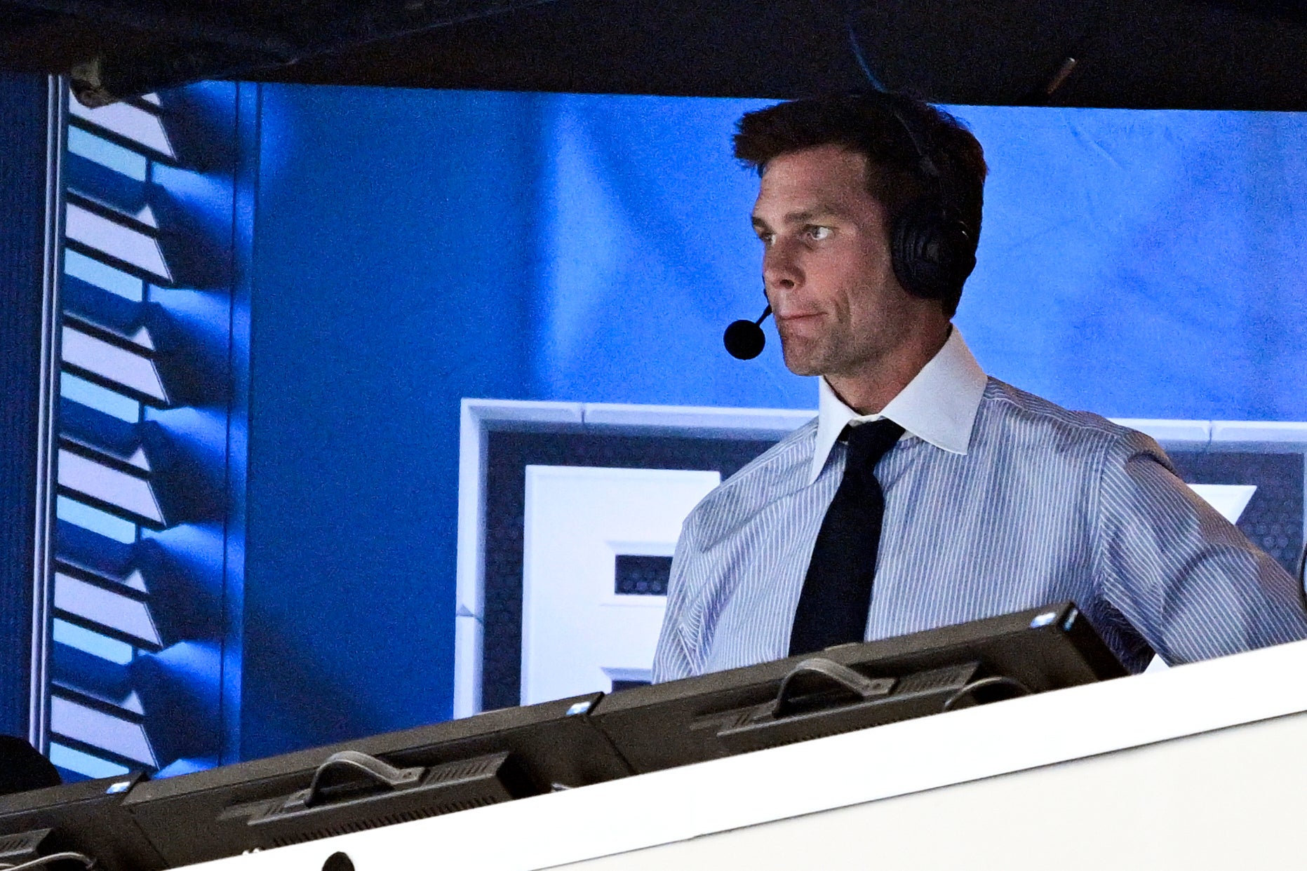 Tom Brady calling an NFL game from a Fox Sports broadcast booth. Brady signed a 10-year, $375 million contract with Fox Sports in 2022