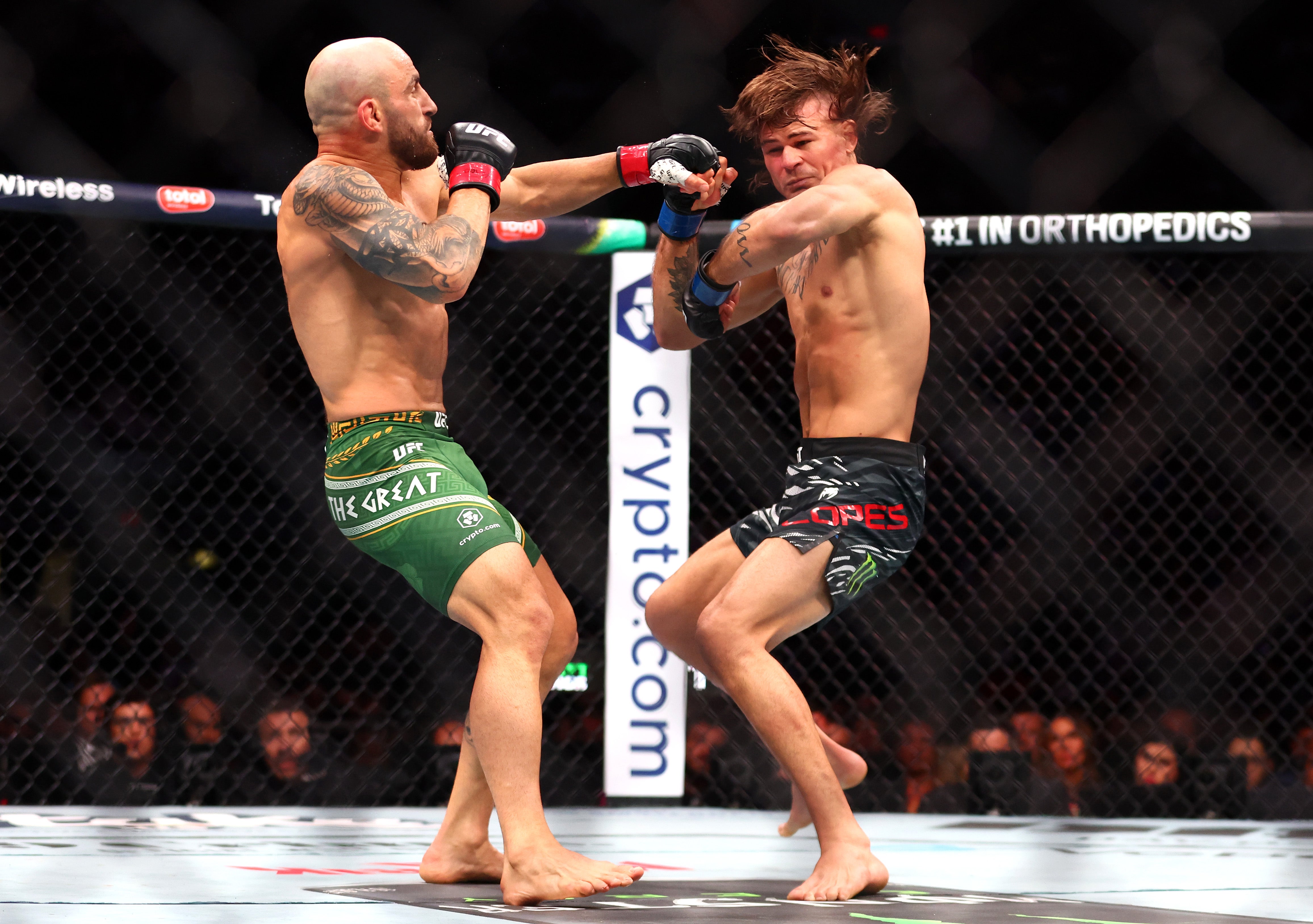 Alexander Volkanovski (left) survives knockdown in April to move past Diego Lopez