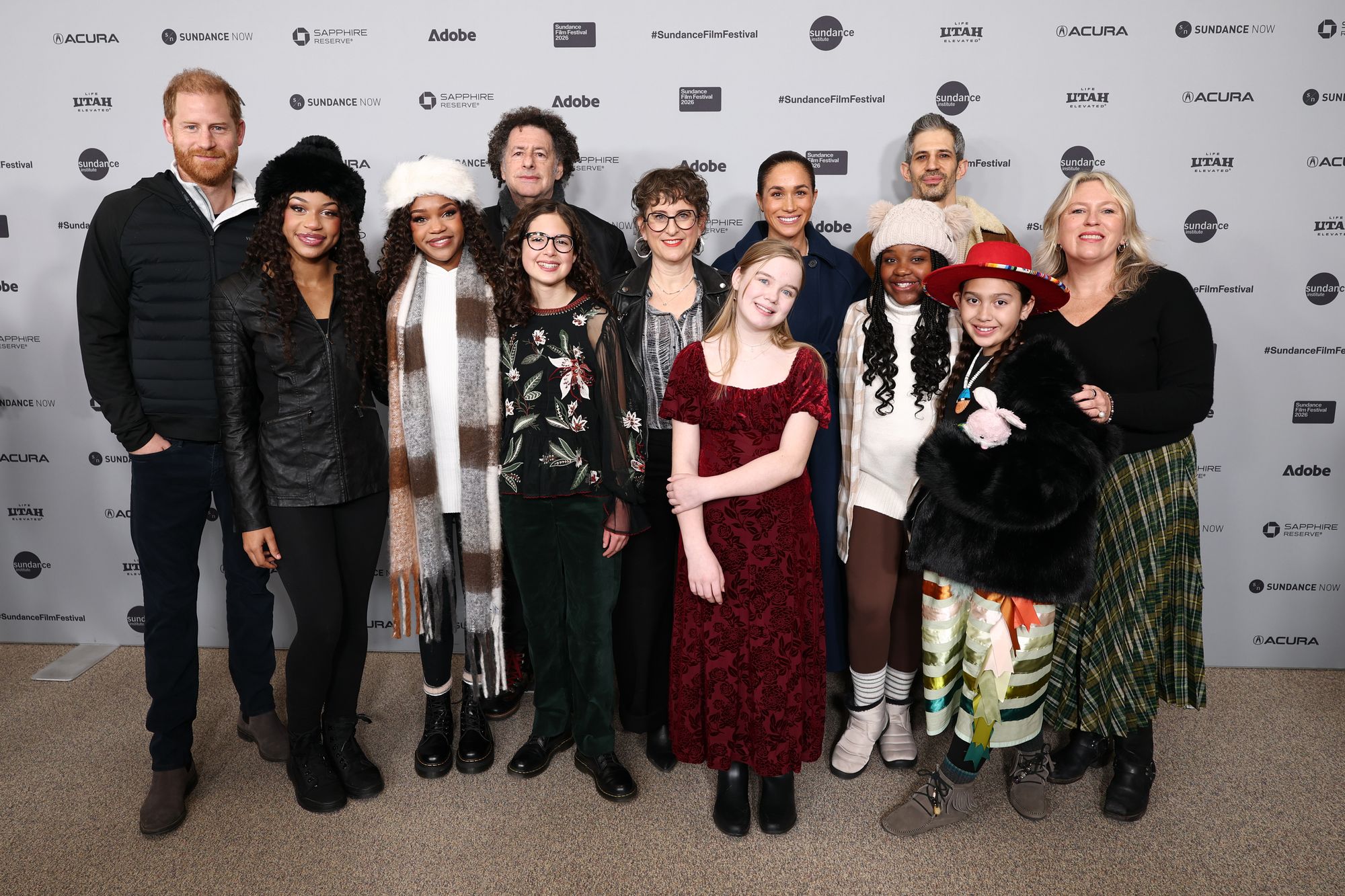 Prince Harry and Meghan Markle pose with the cast and crew at the premiere of 'Cookie Queens' during the 2026 Sundance Film Festival