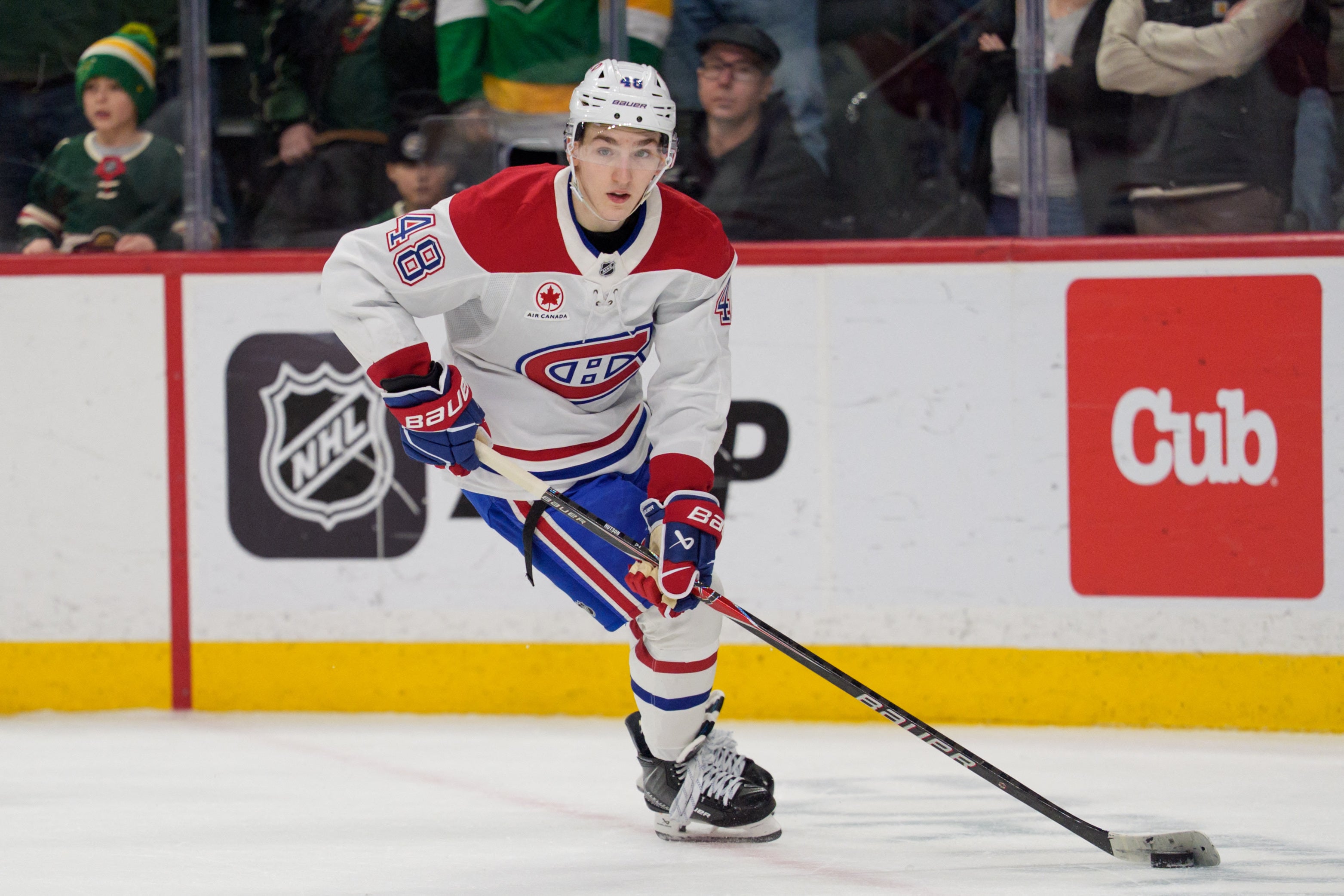 Montreal Canadiens defenseman Lane Hutson handles the puck during overtime against the Minnesota Wild on Feb. 2 at Grand Casino Arena.